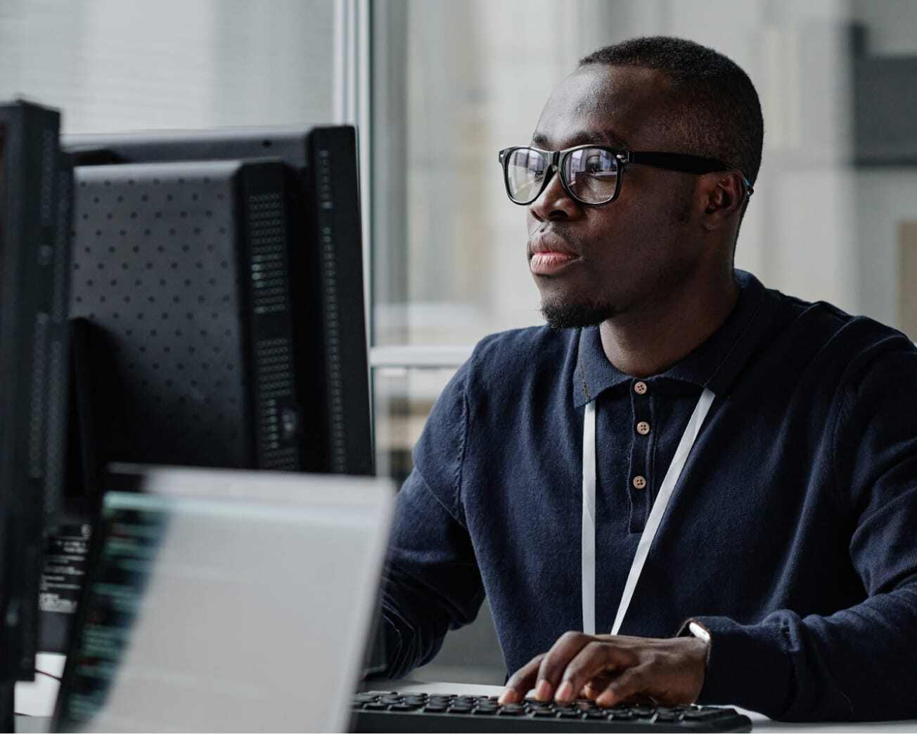 man completing training on a computer